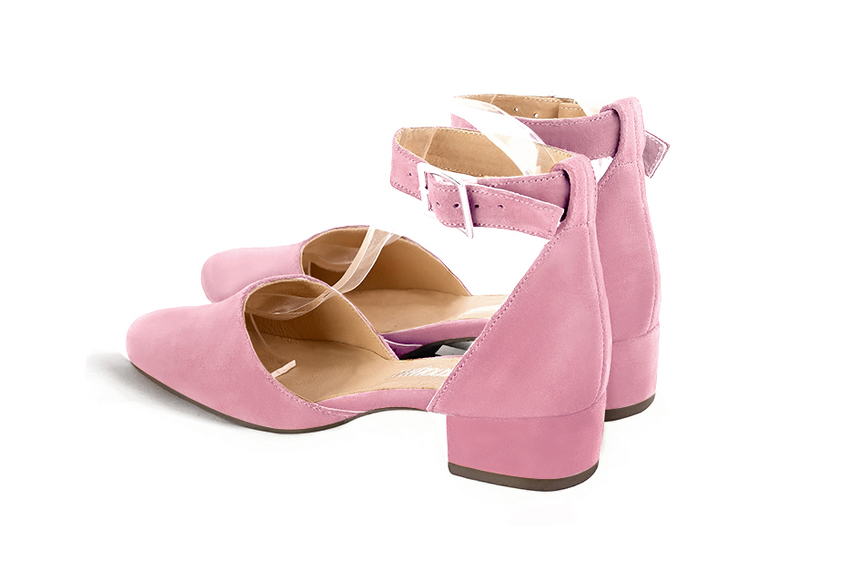 Women's carnation pink open side dress shoes, with a strap around the ankle. Round toe. Low block heels - Rear view